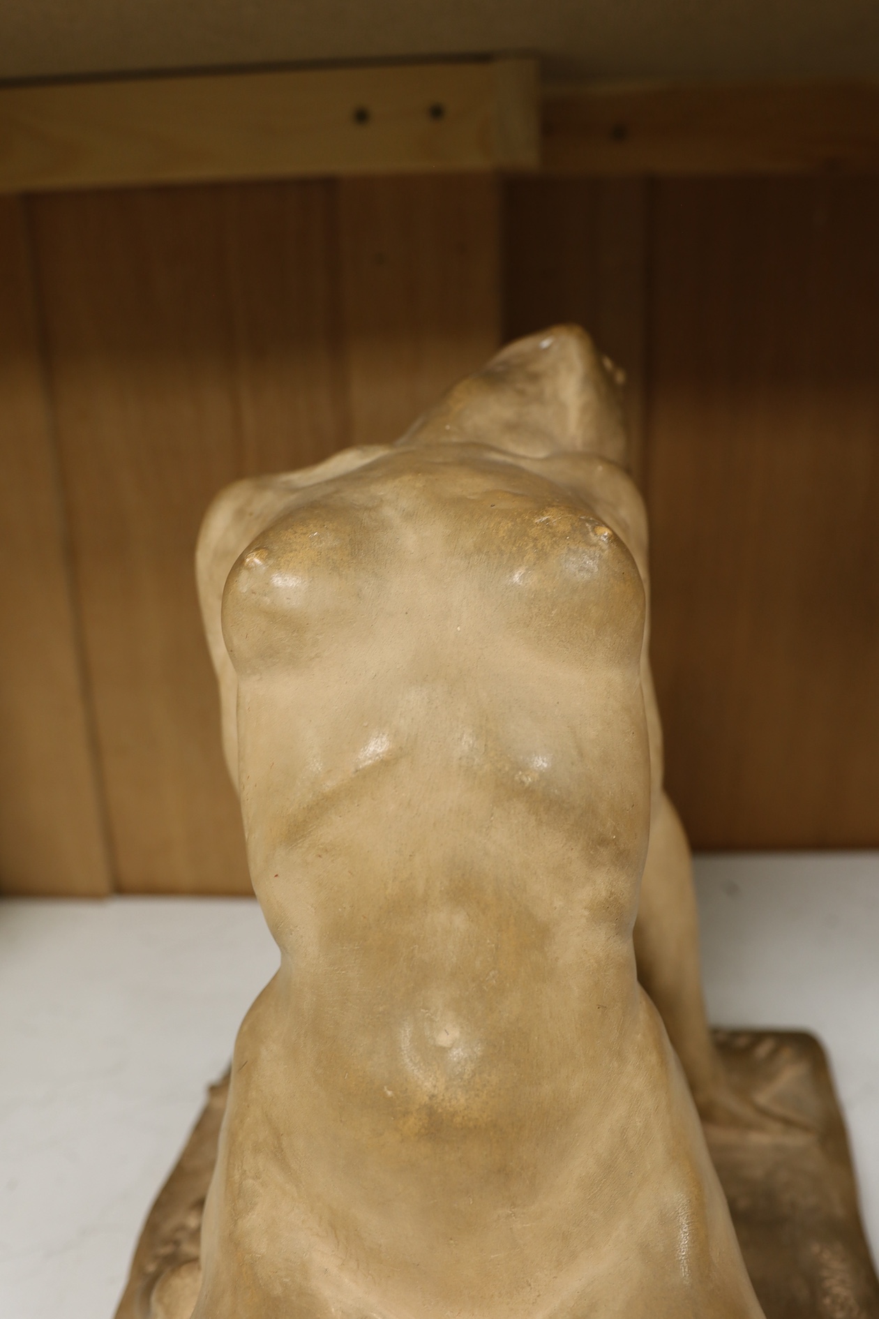 A French Art Deco terracotta semi reclining nude, stamped M. Lequesne, 36cm high. Condition - fair to good, slight scratches